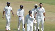 India's captain Virat Kohli (2L) walks with teammates on the fifth day of a solo Test match between India and Bangladesh at the Rajiv Gandhi International Cricket Stadium on February 13, 2017. (AFP / NOAH SEELAM)