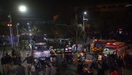 Pakistani police and rescue officials gather at the site of a bomb explosion in Lahore on February 13, 2017. AFP / ARIF ALI
