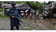 An armed policeman guards a road at the Aung Mingalar displacement camp for Rohingya in Sittwe, in September 2016. (AFP/Romeo Gacad).