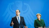 German Chancellor Angela Merkel and Tunisian Prime Minister Youssef Chahed adress the media after a meeting at the Chancellery in Berlin on February 14, 2017. German Chancellor Angela Merkel is expected to press Tunisia's Prime Minister Youssef Chahed to 