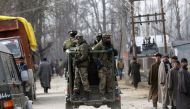 Indian paramilitary soldiers travel in a vehicle after a gunbattle in Hajin, some 38 kilometres (23.75 miles) north-east of Srinagar on February 14, 2017. Three soldiers and a suspected militant were killed in a gunbattle in Indian-administered Kashmir, a