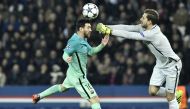 Barcelona's Argentinian forward Lionel Messi (L) vies with Paris Saint-Germain's German goalkeeper Kevin Trapp during the UEFA Champions League round of 16 first leg football match between Paris Saint-Germain and FC Barcelona on February 14, 2017 at the P