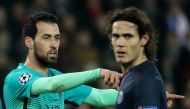 Paris Saint-Germain's Edinson Cavani and Barcelona's Sergio Busquets Reuters / Christian Hartmann 
