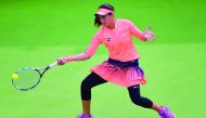 Fatma Al Nabhani of Oman hits a return to Barbora Strycova of Czech Republic during their Qatar Total Open first round at the Khalifa International Tennis Complex in Doha yesterday.  Pic: Anvar C H
