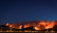 Wildfires threaten a suburb of Christchurch on New Zealand's South Island taken after sunset, February 15, 2017. Picture taken February 15, 2017. REUTERS/Mark Hannah 