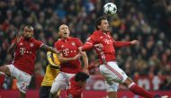 (L-R) Bayern Munich's Chilian midfielder Arturo Vidal, Arsenal's Swiss midfielder Granit Xhaka, Bayern Munich's Dutch midfielder Arjen Robben and Bayern Munich's defender Mats Hummels jump for the ball during the UEFA Champions League round of sixteen foo
