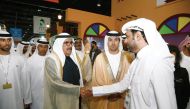 A Qatari official receiving a VIP visitor at the Qatar pavilion in Dubai World Trade Centre.