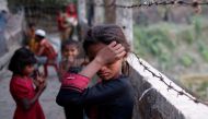 A Rohingya refugee girl wipes her eyes as she cries at Leda Unregistered Refugee Camp in Teknaf, Bangladesh, February 15, 2017. REUTERS/Mohammad Ponir Hossain TPX IMAGES OF THE DAY.