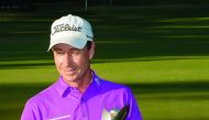 Brett Rumford of Australia poses with the winner's trophy after winning the final of the new World Super 6 golf tournament in Perth yesterday. 