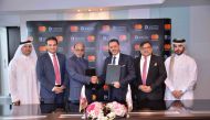 Dr R Seetharaman (third left), Group CEO of Doha Bank; and other senior officials from Doha Bank and Mastercard at the signing ceremony.