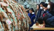 A large number of Ema, wooden votive tablets with wishes on them, are seen at Yushima Tenmangu Shrine in Tokyo on February 18, 2017. Throngs of students and their parents come to the shrine to pray for their educational success as the annual school entran