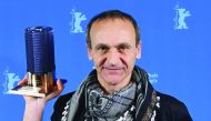 Palestinian director Raed Andoni poses after being awarded for Best documentary for his film 