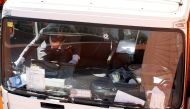 An investigator is seen inside a gas cylinder delivery truck with bullet holes in its windscreen after police fired shots to stop the driver, whom they say had stolen the truck and was driving against traffic, in Barcelona, Spain, February 21, 2017. REUTE