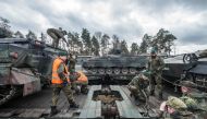 German soldiers load armored vehicles of the type 