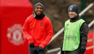 Manchester United's Ashley Young and Wayne Rooney during training. Reuters / Andrew Yates