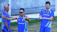 Australia's Mitchell Starc (left) and his team-mate Josh Hazlewood stretch during the final day of three-day practice match against India A at the Brabourne Stadium in Mumbai on Sunday. 