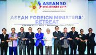 Association of South East Asian Nations (Asean) Foreign Ministers link arms during the retreat in Boracay, central Philippines, yesterday. 