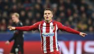 Atletico Madrid's French forward Kevin Gameiro celebrate after scoring a penalty during the UEFA Champions League round of 16 first-leg football match between Bayer 04 Leverkusen and Club Atletico de Madrid in Leverkusen, western Germany on February 21, 2