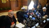 A representative from the Vatican French cardinal Jean-Louis Tauran (L), president of the Pontifical Council for Interreligious Dialogue in the Roman Curia, and Abbas Shuman (2nd-L), deputy imam of Cairo's al-Azhar mosque, attend a joint seminar in Cairo 