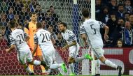 Juventus' Brazilian defender Dani Alves (2R) celebrates after scoring a goal during the UEFA Champions League round of 16 second leg football match FC Porto vs Juventus at the Dragao stadium in Porto on February 22, 2017. / AFP / MIGUEL RIOPA

