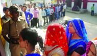 People wait for their turn to vote at a polling station in the Naini area on the outskirts of Allahabad during the fourth phase of Uttar Pradesh assembly elections, yesterday.