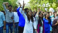 Members of India's right-wing student group ABVP shout slogans during a protest march at the Delhi University yesterday. Violent clashes between ABVP and left-leaning All India Students Association broke out at a Delhi University college over a seminar in