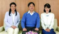 Crown Prince Naruhito (centre) posing with Crown Princess Masako (left) and their daughter Princess Aiko at Togu Palace, in Tokyo. 