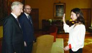 (From L) King Philippe - Filip of Belgium, Belgian Prime Minister Charles Michel stand as Zuhal Demir gestures during the oath ceremony of Demir as new State secretary for the fight against poverty, equal opportunities, disabled, science politic and big c
