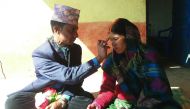 In this photograph taken on February 23, 2017, Nepalese prisoners Dilli Koirala (L) and Mimkosha Bista take part in their wedding ceremony inside Kalikot District Jail in Kalikot, some 388km from Kathmandu. A man and a woman each serving time for killing 