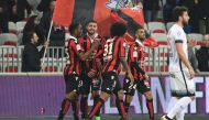 Nice's French forward Mickael Le Bihan (2ndL) celebrates with teammates after scoring his team's second goal during the French L1 football match OGC Nice vs Montpellier HSC at the Allianz Riviera Stadium in Nice on February 24 ,2017 / AFP / Yann COATSALIO