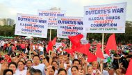 Philippine President Rodrigo Duterte supporters gather during a vigil backing the anti-drugs crackdown at the Luneta park in metro Manila, Philippines February 25, 2017. (Reuters/Romeo Ranoco)