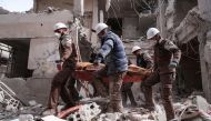 Syrian civil defence volunteers, known as the White Helmets, search for survivors following regime airstrike on the opposition-held neighbourhood of Tishrin on February 22, 2017. (AFP PHOTO).