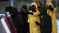 Members of Malaysia's Hazmat team conduct a decontamination operation at the departures terminal of the Kuala Lumpur International Airport 2 (KLIA 2) in Sepang on February 26, 2017. AFP / MANAN VATSYAYANA
