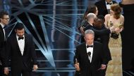 Actor Warren Beatty (R) announces the actual Best Picture winner as 'Moonlight,' not 'La La Land,' after a presentation error onstage during the 89th Annual Academy Awards at Hollywood & Highland Center on February 26, 2017 in Hollywood, California. Kevin