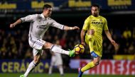 Real Madrid's Portuguese forward, Cristiano Ronaldo (L) vies with Villareal's defender Mario Gaspar during the Spanish League football match Villarreal CF vs Real Madrid at El Madrigal stadium in Vila-real on February 26, 2017. / AFP / BIEL ALINO
