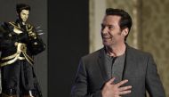 Australian actor Hugh Jackman admires a Wolverine puppet gift during a press conference for the film 