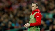 Manchester United's Wayne Rooney warms up on the sideline during the match. Reuters / Carl Recine
