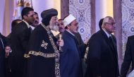 Egypt's Grand Imam of al-Azhar Sheikh Ahmed Mohamed al-Tayeb (C) Egypt’s former interim president Adly Mansour (R), and Leader of Egypt's Coptic Church, Pope Tawadros II (L) of Alexandria arrive to attend a conference titled “Freedom and citizenship” host