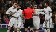 Real Madrid's Gareth Bale (L) argues with the referee. REUTERS/Sergio Perez
