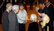 Japan's Emperor Akihito and Empress Michiko meet with family members of Japanese veterans living in Vietnam at a hotel in Hanoi, yesterday.