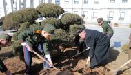 North Korean leader Kim Jong Un visited Mangyongdae Revolutionary School and planted trees with its students on Thursday, the Tree-planting Day, in this undated photo released by North Korea's Korean Central News Agency (KCNA) in Pyongyang March 3, 2017. 