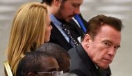 This file photo taken on January 25, 2017 shows US actor and former governor of California Arnold Schwarzenegger (R), flanked by his girlfriend Heather Milligan, as he attends the Pope's weekly general audience at the Paul VI hall of the Vatican. AFP / Al