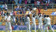 Indian players celebrate the catch dismissal of Australian captain Steve Smith (L) during the second day of the second cricket Test match between India and Australia at The M. Chinnaswamy Stadium in Bangalore on March 5, 2017. AFP / Manjunath Kiran / Gett