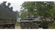 Philippine marines aboard an Amored Personnel Carrier and a truck guard a highway in Indanan town on the southern island of Mindanao on Feb 27, 2017, after reports of the beheading of German national Jurgen Kantner by the Abu Sayyaf group. (Photo: AFP/Nic