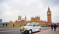 A London Cab adorned with Gulf Air brand.