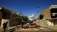 Smoke rises from a car bomb that exploded during a battle with Islamic State militants in Mosul, Iraq, March 6, 2017. REUTERS/Thaier Al-Sudani

