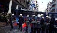 Riot police stand guard during clashes with Greek farmers from the island of Crete outside the Agriculture Ministry in Athens, Greece March 8, 2017. REUTERS/Alkis Konstantinidis.