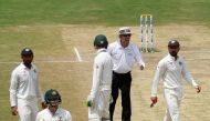 India's captain Virat Kohli (R) speaks to the umpire as Australia's captain Steven Smith (2nd L) walks off the ground after being dismissed. (REUTERS/Danish Siddiqui)