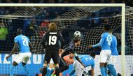 Real Madrid's defender Sergio Ramos (C) scores during the UEFA Champions League football match SSC Napoli vs Real Madrid on March 7, 2017 at the San Paolo stadium in Naples. / AFP / Alberto PIZZOLI
