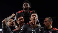 Bayern Munich's Polish forward Robert Lewandowski (2R) celebrates with Bayern Munich's Spanish midfielder Xabi Alonso (C), Bayern Munich's Austrian defender David Alaba, Bayern Munich's French midfielder Franck Ribery (R) and Bayern Munich's Chilean midfi